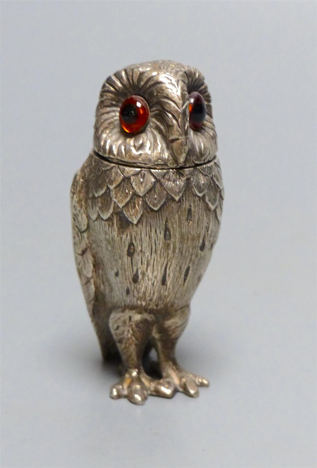 A 1960's novelty silver pepperette, modelled as an owl, William Comyns & Sons Ltd, London, 1962, 76mm, gross 3.5oz.